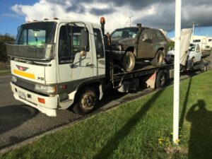 Scrap truck transporting end-of-life vehicles