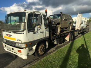 Tow truck collecting an unwanted car
